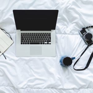 top-down-view-working-from-home-on-a-bed